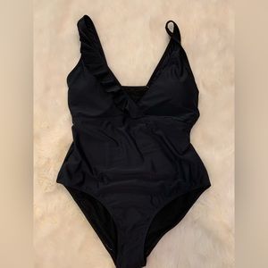 New Pamela Stewart Black SWIM Bathing Suit size L One-piece Ruffle detail NWOT